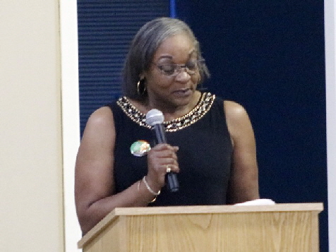 Jacquetta Hudson, WBHHC, Vice President announcing one of $1,000 scholarship winners-